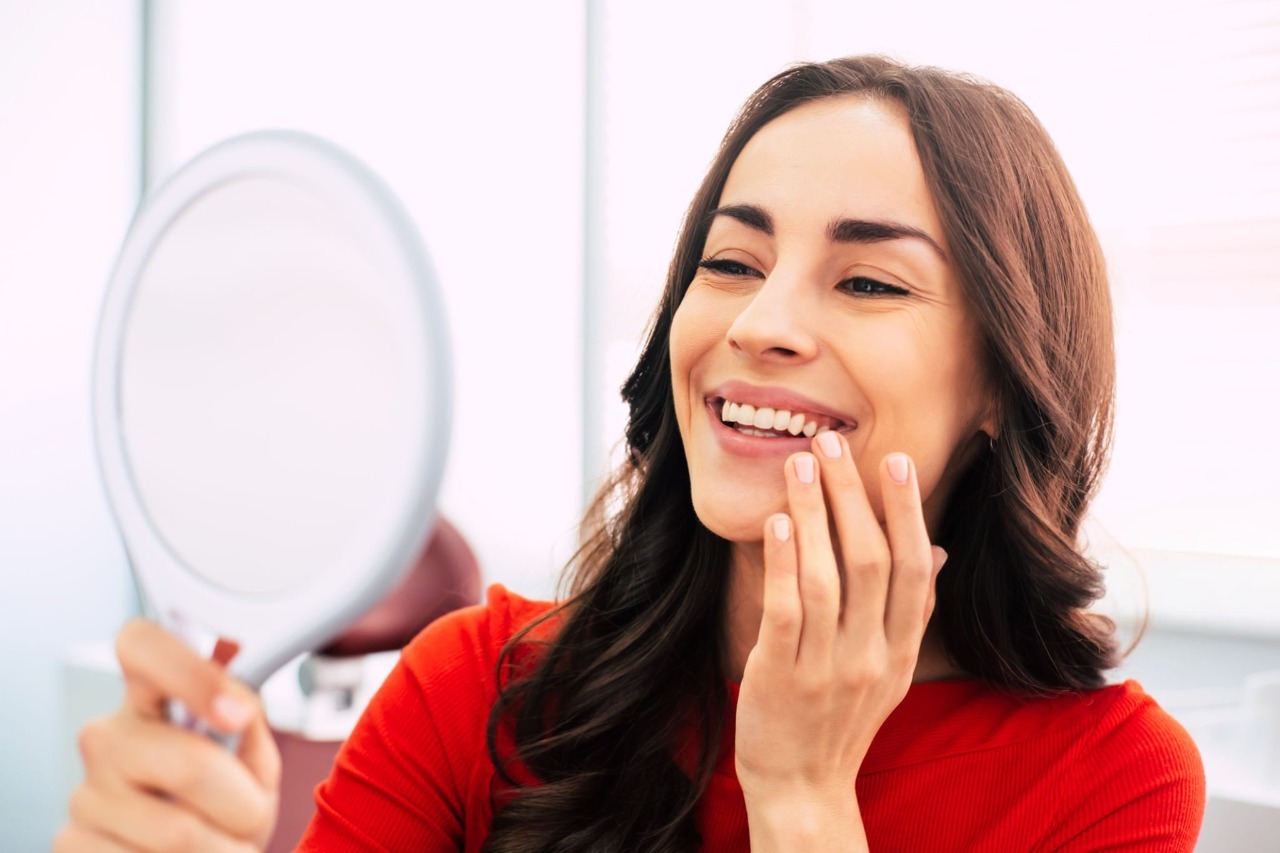 Woman happy to see dental implants